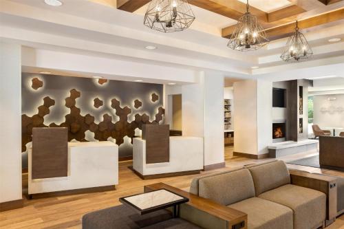 a living room with a couch and a fireplace at Hyatt Place Keystone - Dillon in Keystone
