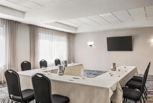 a conference room with tables and chairs and a flat screen tv at Hyatt Place Keystone - Dillon in Keystone