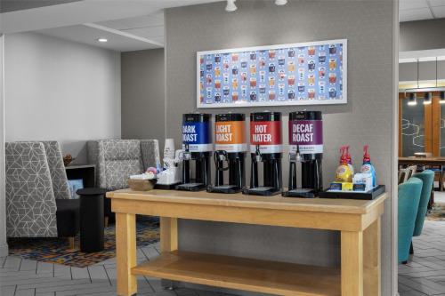 a table in a waiting room with bottles on it at Hampton Inn Lexington Medical Center, KY in Lexington