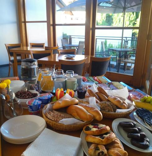 a table with a bunch of food on it at Apartmány s výhledem na zámek in Vimperk