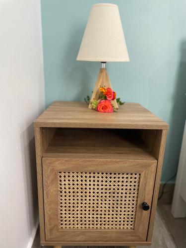 a table with a lamp on top of it at Casa Solmes Rooms in Olbia