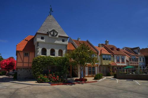 a building with a clock on the top of it at Royal Copenhagen Inn in Solvang