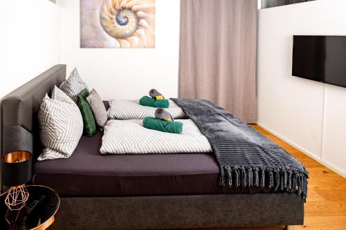 a couch with pillows on it in a living room at Ferienwohnung Waldrose in Waging am See