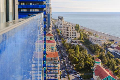 a view of a city from a building at Glorious Sea View Aparthotel In Orbi City Batumi in Batumi