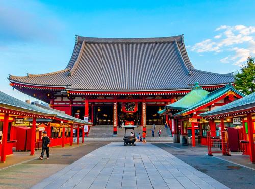 a large building with a large roof with red columns at Hotel Trend Asakusa in Tokyo