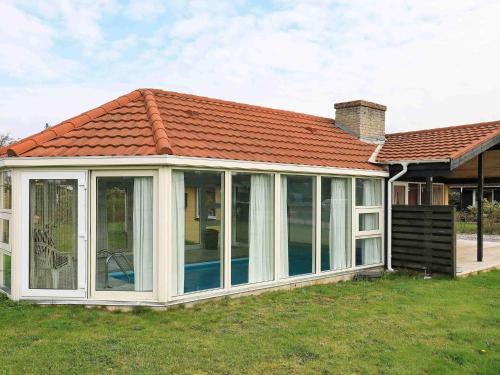 an apex conservatory with a red roof at 6 person holiday home in Ulfborg-By Traum in Sønder Nissum