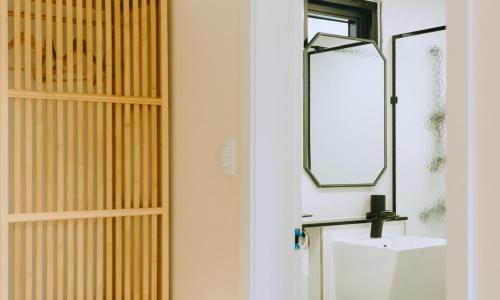 a bathroom with a sink and a mirror at Chuncheon bali 376 