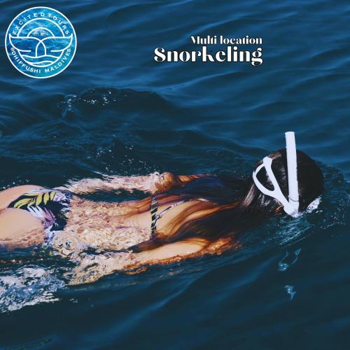 a woman floating in the water with a rope at All Inclusive Stays by Excited Tours - Dhiffushi in Dhiffushi