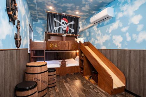a room with a pirate themed room with a bunk bed at JAPAVISTA Unlimited in Osaka