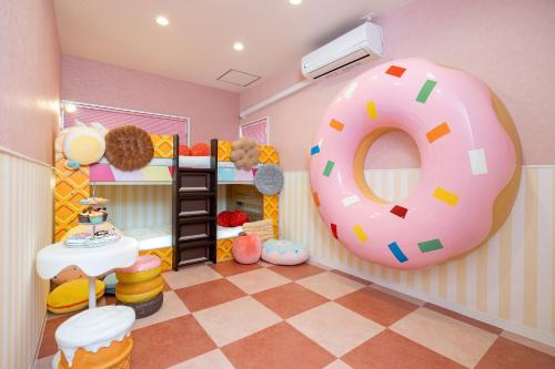 a room with a giant donut on the wall at JAPAVISTA Unlimited in Osaka