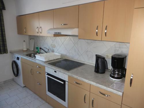 a kitchen with a sink and a counter top at Ferienwohnung Stadtblick in Bräunlingen