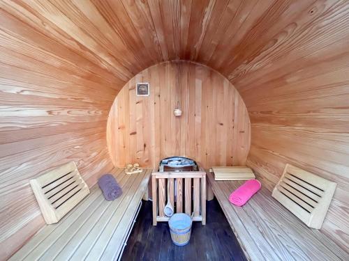 an overhead view of a wooden cabin with two benches at Apartment PLAZA -Wallbox 11kW- Private SPA- Jacuzzi, Infrared Sauna, Luxury massage chair, Parking, Entry with PIN 0 - 24h, FREE CANCELLATION 24 hours before Check In,Premium pillows and mattress in Slavonski Brod