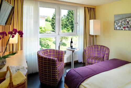 Postel nebo postele na pokoji v ubytování Hotel Alexander