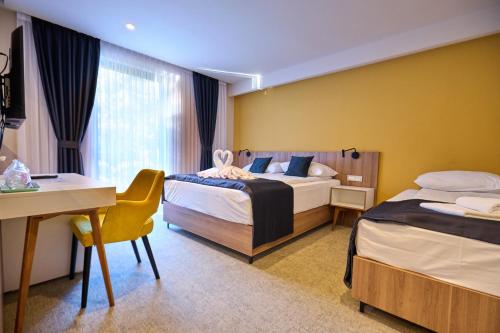 Postel nebo postele na pokoji v ubytování Hotel Luna Bihać