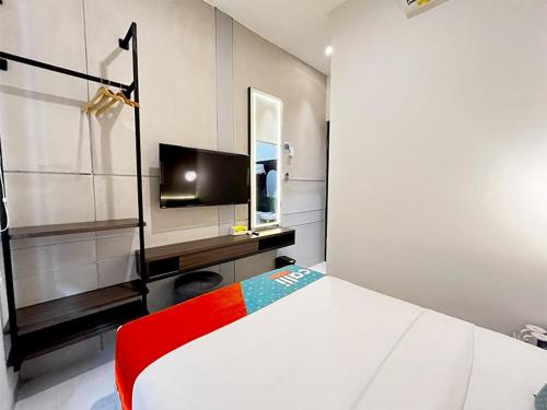 Katil atau katil-katil dalam bilik di Tansah Tentrem Guest House by Calli Rooms