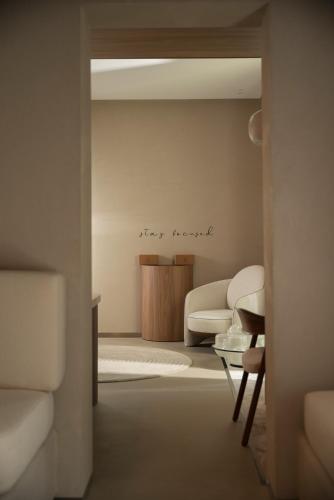 a living room with a couch and a table at Mode Eco Mood Hotel - Adults Friendly in Rimini