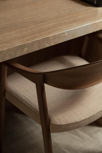 a wooden table with a wooden chair under it at Mode Eco Mood Hotel - Adults Friendly in Rimini