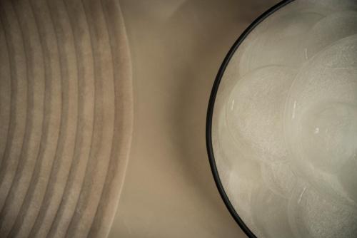 two glass bowls sitting next to each other at Mode Eco Mood Hotel - Adults Friendly in Rimini