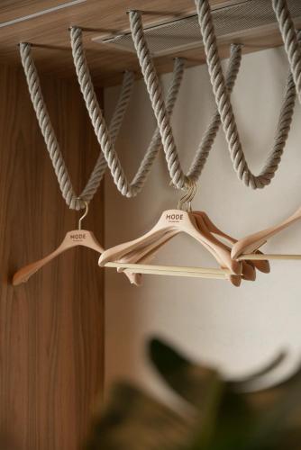 three hangers with ropes hanging from a ceiling at Mode Eco Mood Hotel - Adults Friendly in Rimini
