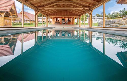 an indoor swimming pool in a house at Privates Chalet Mit Pool in Stainz