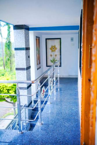 a hallway with a row of chairs in a building at The Chendur Grand in Salem