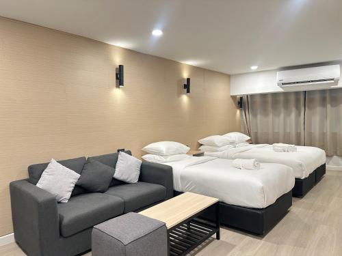 Ένα ή περισσότερα κρεβάτια σε δωμάτιο στο EbS Residence Chaweng