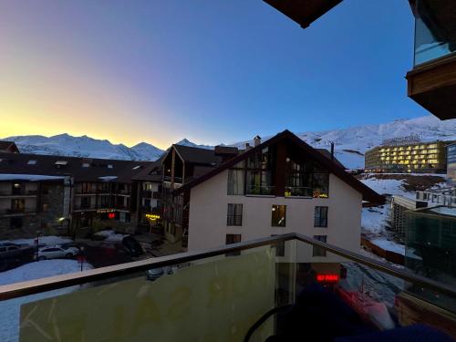 a view of the mountains from the balcony of a hotel at Gudauri Loft 1 in Gudauri