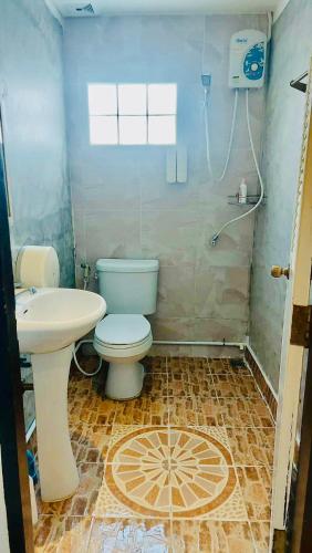 a bathroom with a toilet and a sink at SET INN restaurant & bar 1 & 2 in Kata Beach