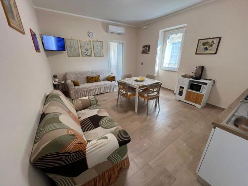a living room with a couch and a table at Villa Fava in Falciano del Massico