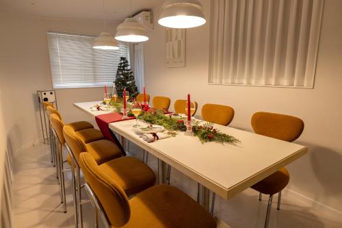 a conference room with a long table and chairs at Harangae in Seoul