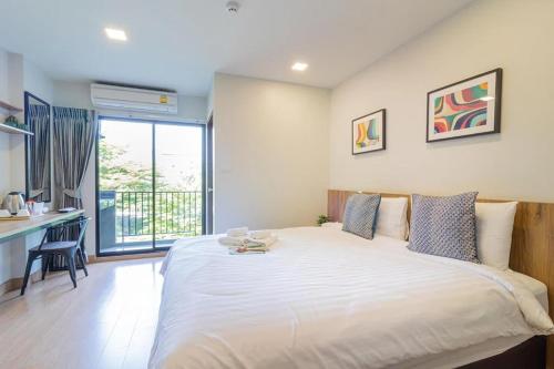 Ένα ή περισσότερα κρεβάτια σε δωμάτιο στο Casa Luxe Hotel and Resident