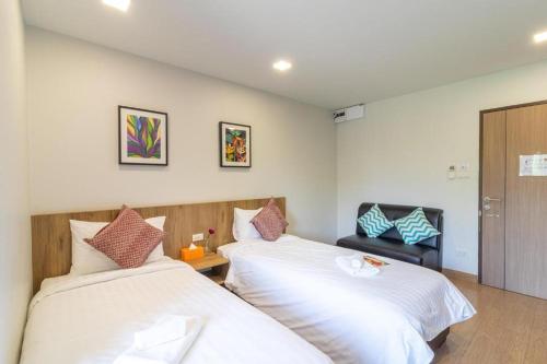 Ένα ή περισσότερα κρεβάτια σε δωμάτιο στο Casa Luxe Hotel and Resident