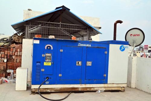 a large blue building with at Hotel shiva international in Varanasi