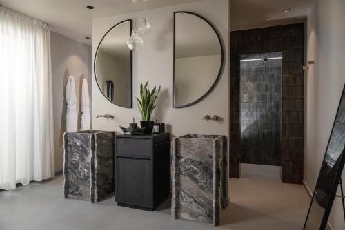 a bathroom with a black vanity and a shower at Mode Eco Mood Hotel - Adults Friendly in Rimini