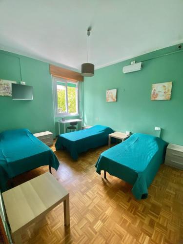 Ένα ή περισσότερα κρεβάτια σε δωμάτιο στο Green House - Manerbio