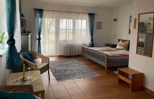 Ένα ή περισσότερα κρεβάτια σε δωμάτιο στο Pferdehof Ruhnau