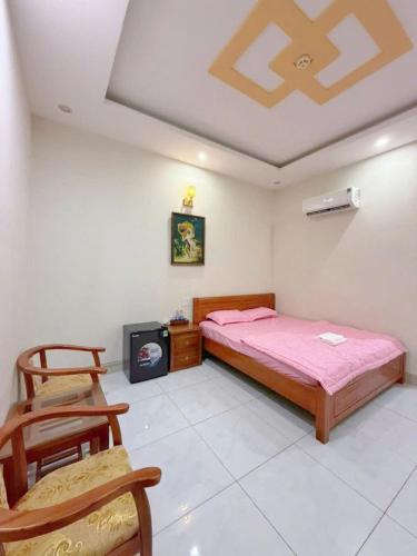Ένα ή περισσότερα κρεβάτια σε δωμάτιο στο Cali Hotel Tây Ninh