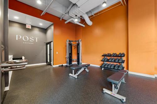 a fitness room with a gym with weights at 4BR Corporate Suite Central and Modern in Chicago