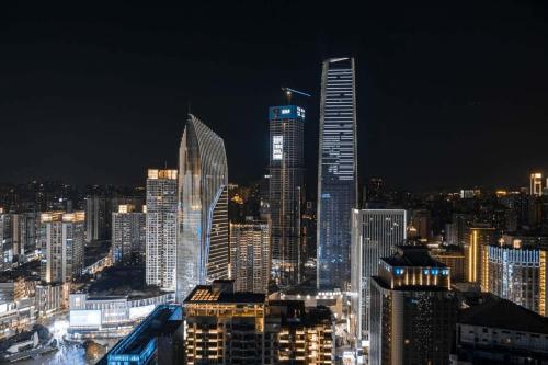 a night view of a large city with tall buildings at Changliu ·S Skyview Hotel in Chongqing