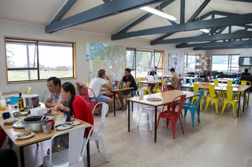 a group of people sitting at tables in a restaurant at Glentanner Park Centre in Glentanner