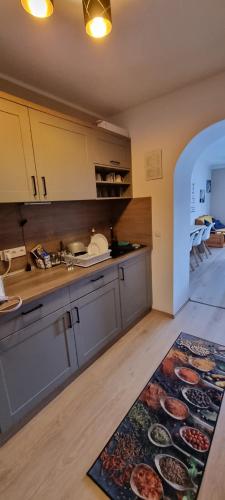 a kitchen with a large rug on the floor at Mountain view apartments in Bad Mitterndorf