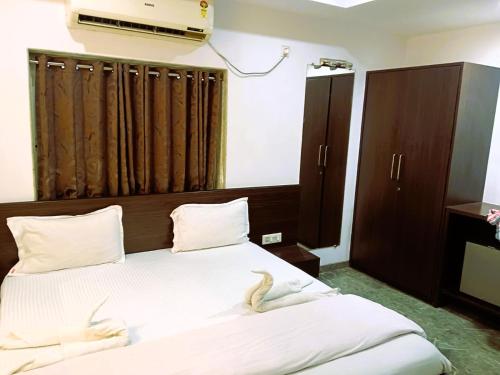 Ένα ή περισσότερα κρεβάτια σε δωμάτιο στο Rani Tower Stay VIP Road