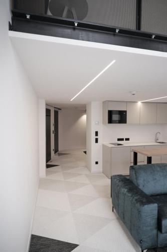 a living room with a couch and a table at Fesh Lofts in Vienna