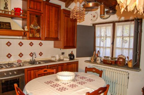 a kitchen with a table with a bowl on it at Chalet La Baita in Baceno