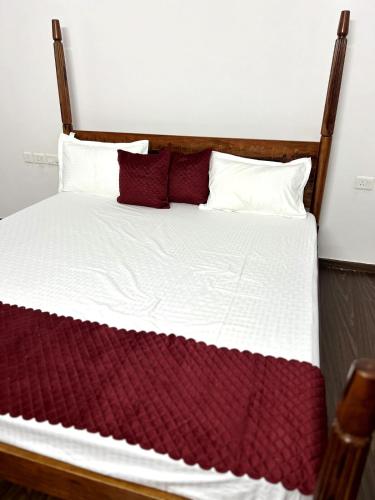 Postel nebo postele na pokoji v ubytování Gharvana