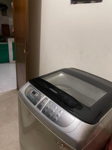 a close up of a toaster oven with at Gulshan Elegant Center 3 BR AC Flat Near Cafes & Shops Heart of Gulshan in Dhaka