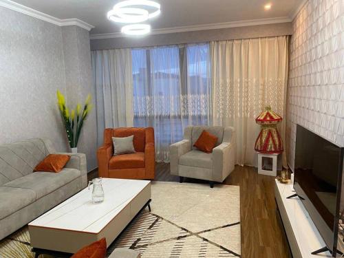 Ein Sitzbereich in der Unterkunft Joy Apartment