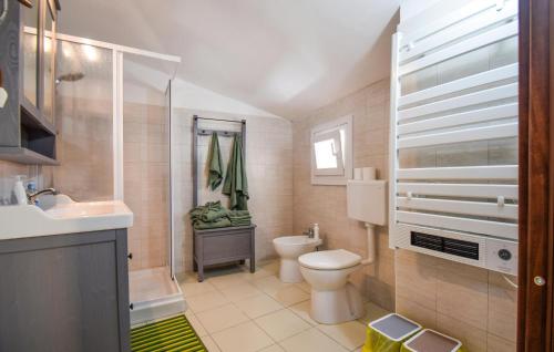 a bathroom with a toilet and a sink at Nice Home In Venafro With House A Mountain View in Venafro