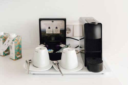 a shelf with a computer and other items on it at Hotel Moon Dreams Paraiso - Adults Recommended in Es Cana
