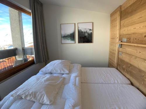 Ένα ή περισσότερα κρεβάτια σε δωμάτιο στο MyHome - Spacieux T4 rénové au cœur du Val Claret - 8pax